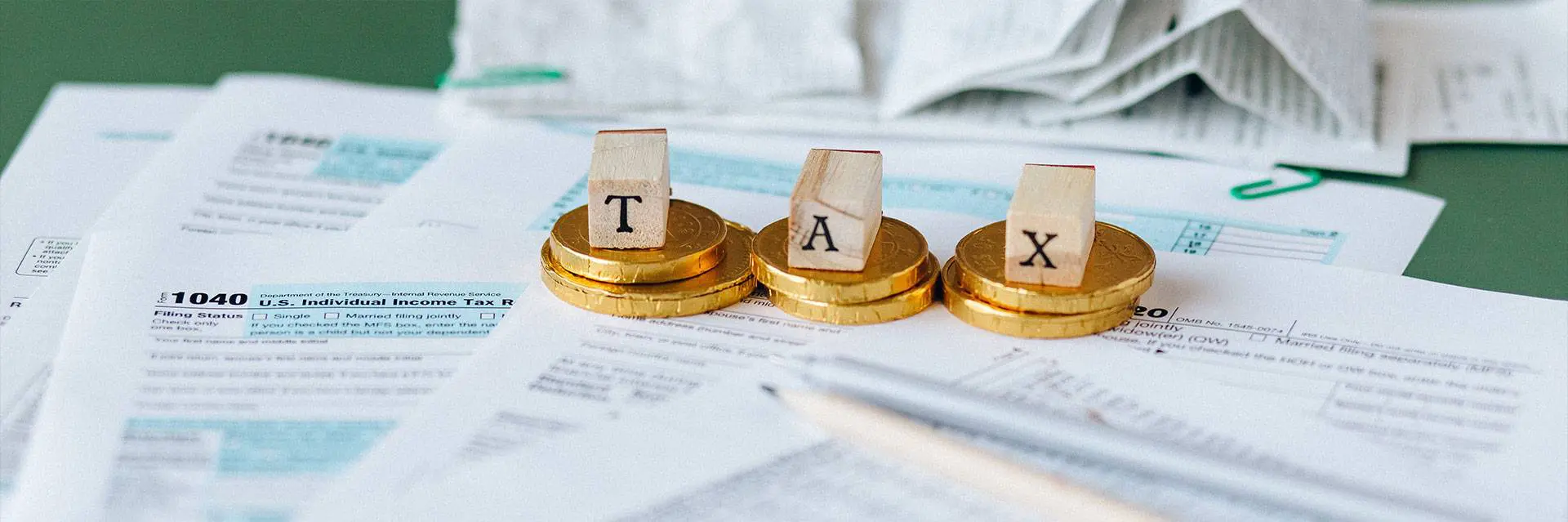 A close up of three coins with the word tax on them